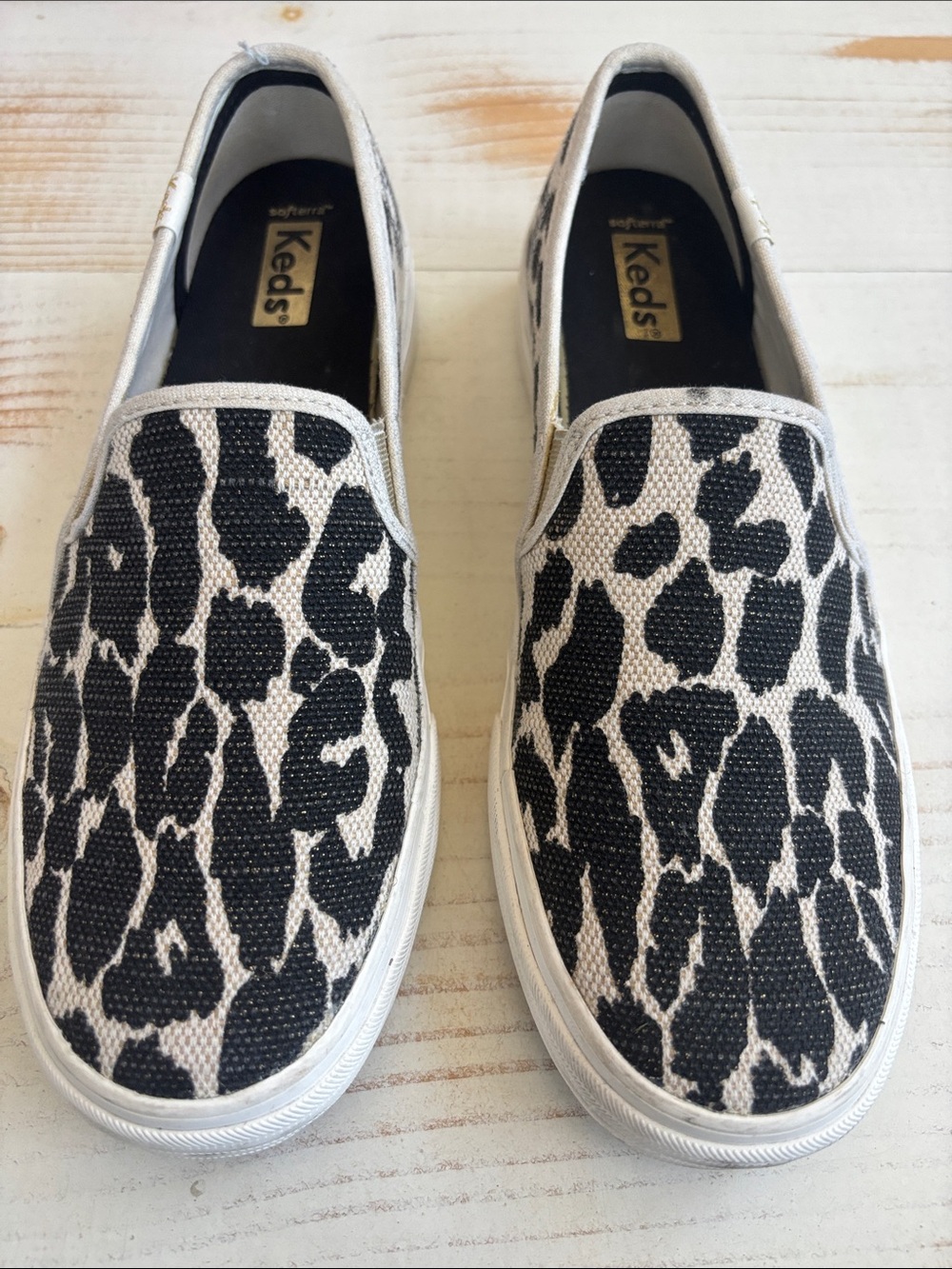 Keds Slip-On Leopard Print Canvas Sneakers in Black and White